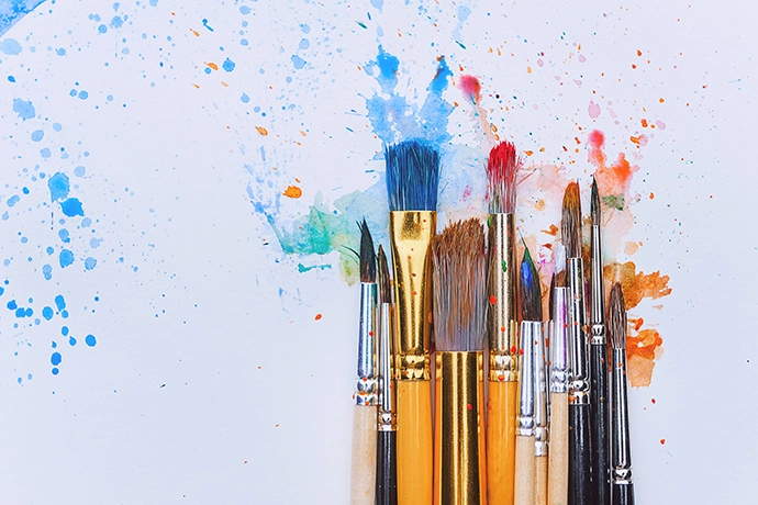 Painting brushes soaked in colors